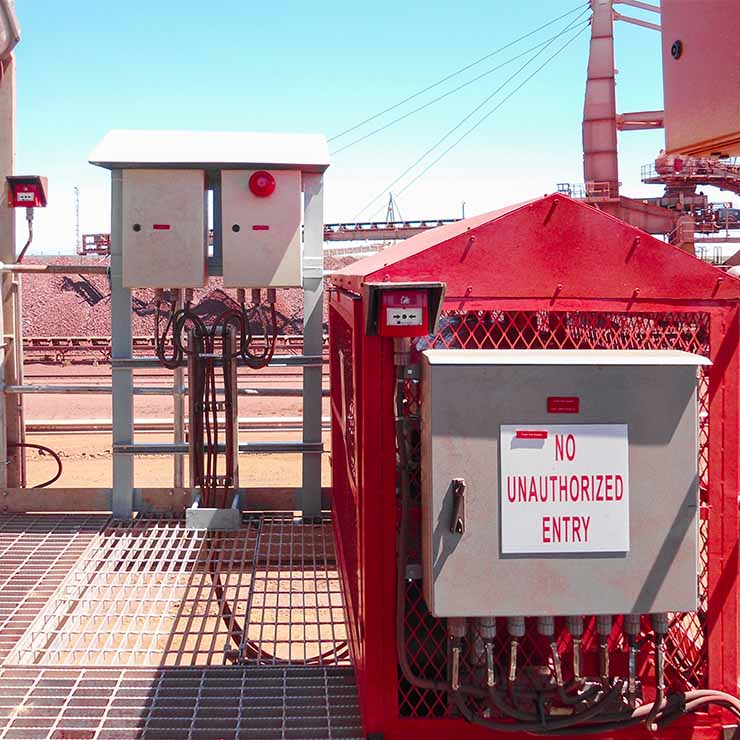 A pressure vessel is filled with Protect-o-Burn's Self Expanding Fire Fighting Foam and is standing ready to protect a massive storage tank filled with oil